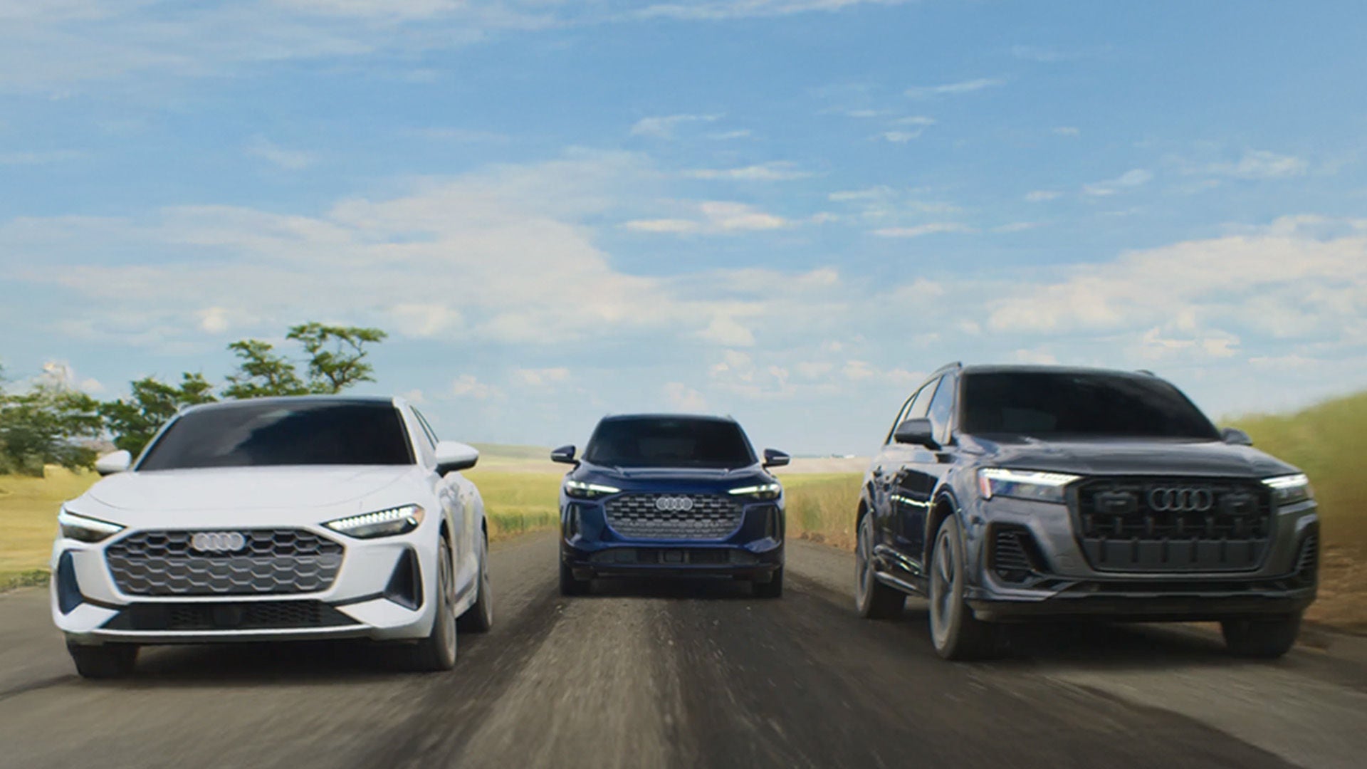 Audi vehicles in a lineup accelerating.
